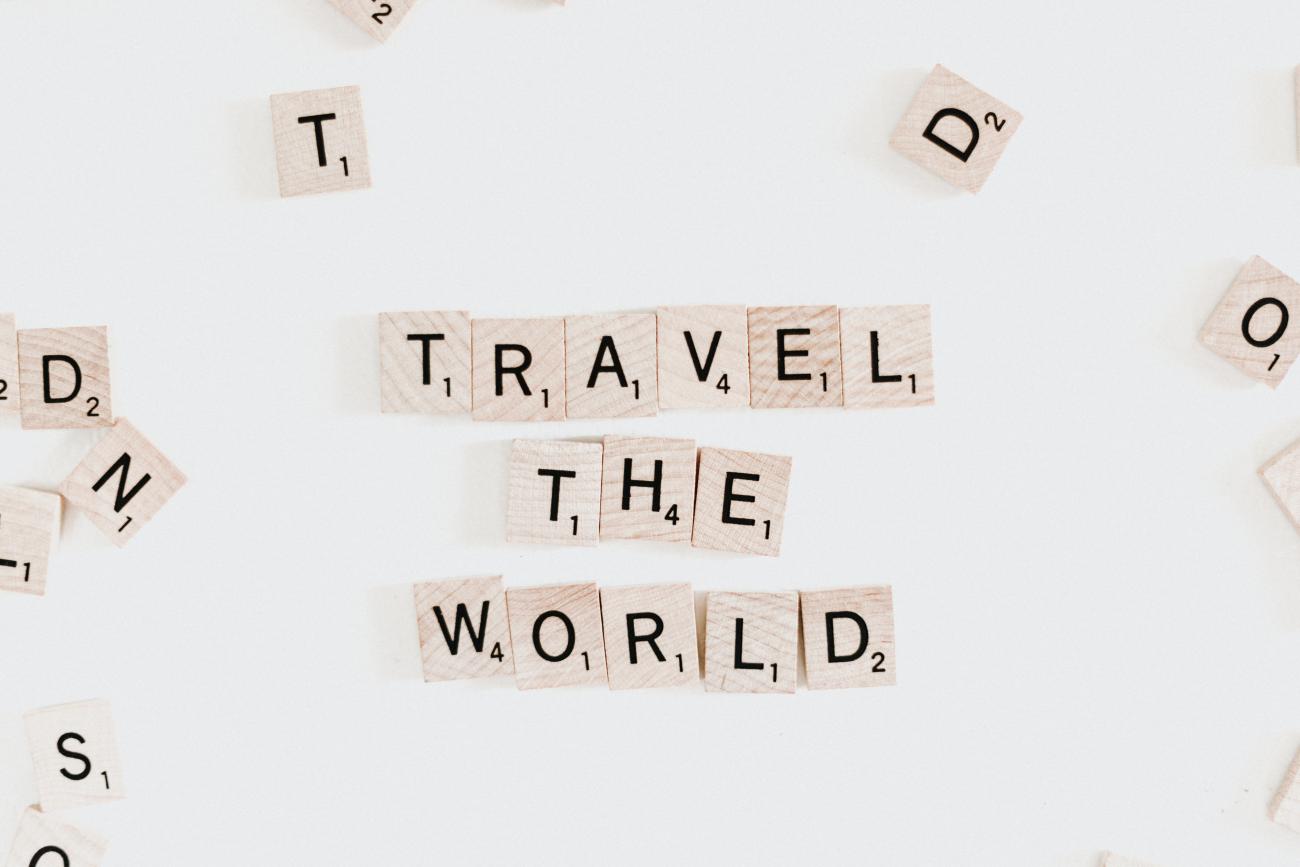 Scrabble tiles spelling, "Travel The World" by Priscilla du Preez