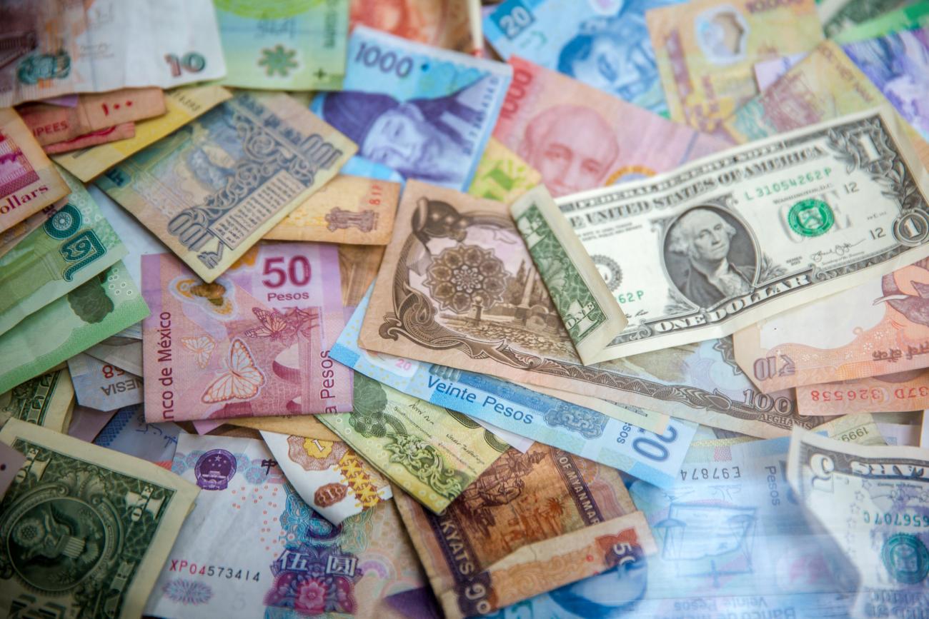 Photo of various currencies of paper money by Jason Leung