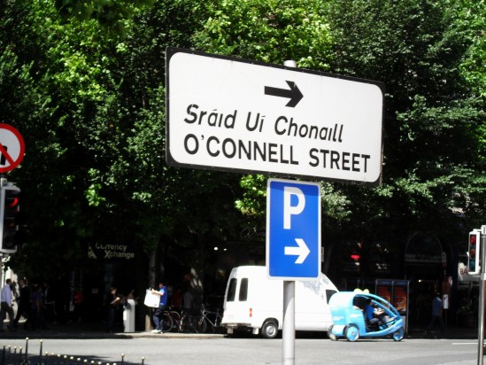 street sign in Ireland with a arrow pointing to the right
