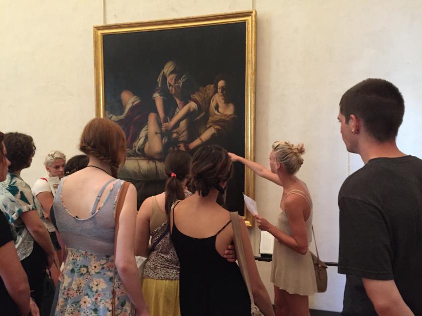 Students in Italy looking at a painting