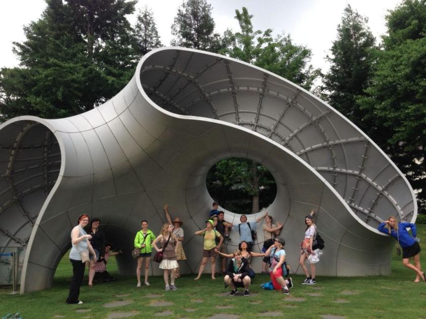 Students in front of sculpture in Tokyo